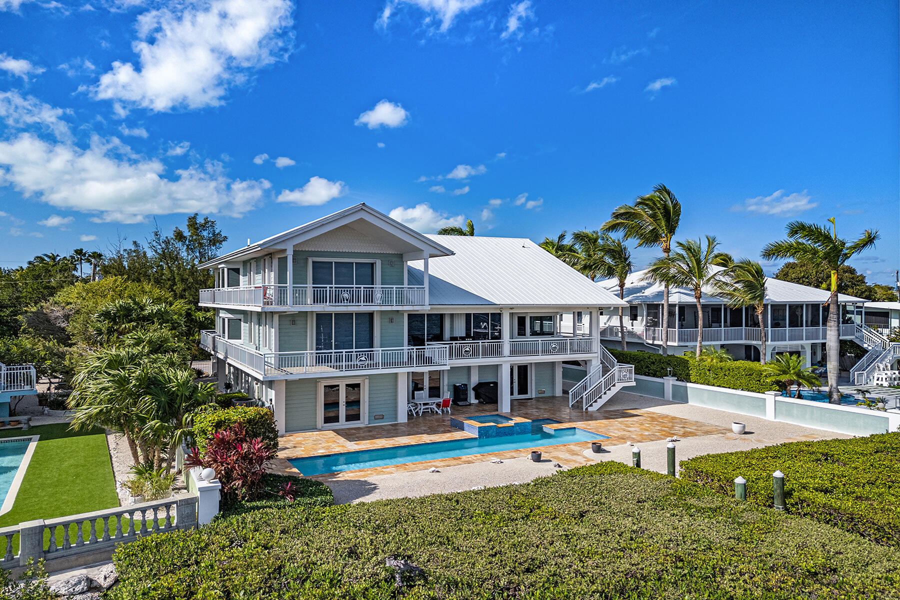21 Mutiny Place Key Largo, FL 33037 - Photo 13 of 57 a view of a house with swimming pool and porch