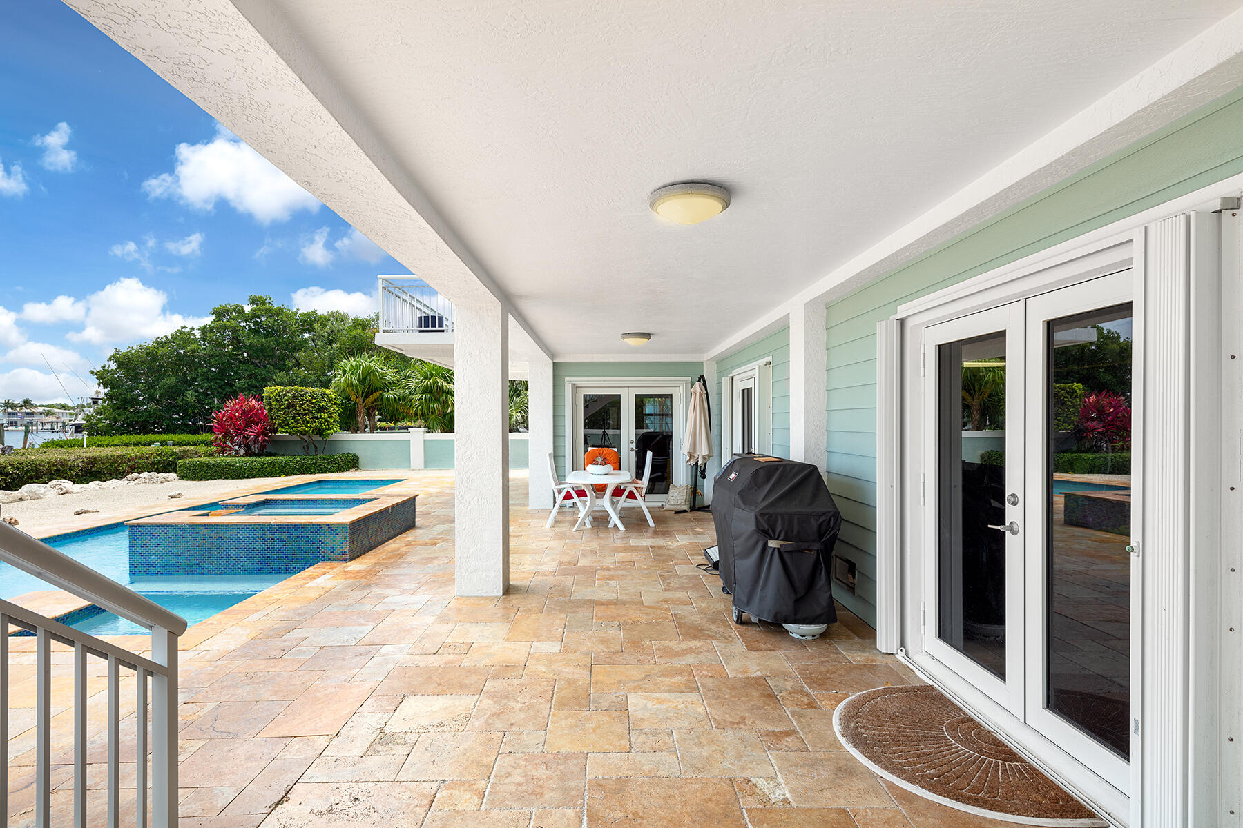 21 Mutiny Place Key Largo, FL 33037 - Photo 23 of 57 a view of a chairs and table in a back yard of the house