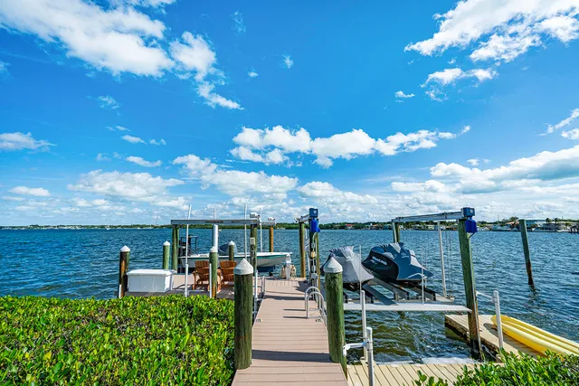 a dining room with furniture a chandelier and fireplace