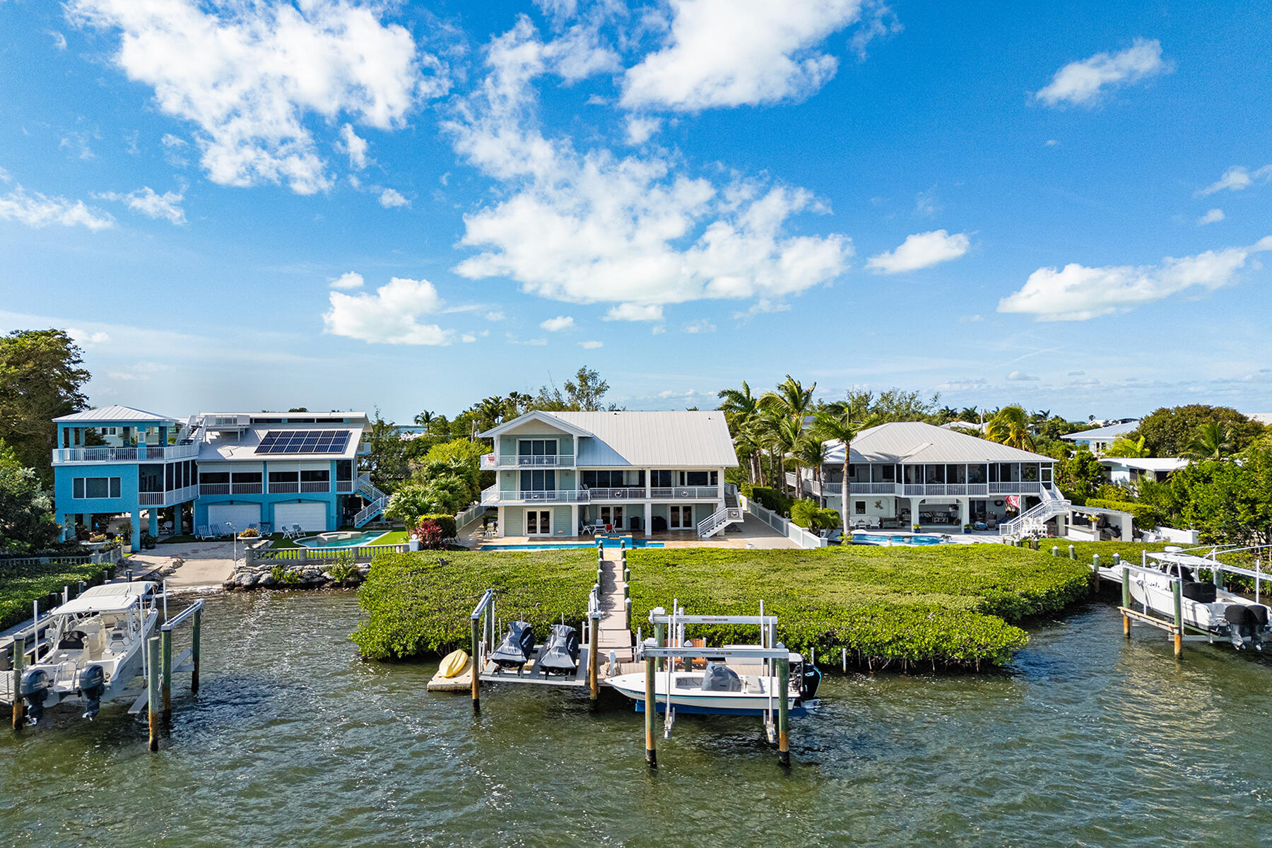 21 Mutiny Place Key Largo, FL 33037 - Photo 51 of 57 a view of houses with swimming pool yard outdoor seating and lake view