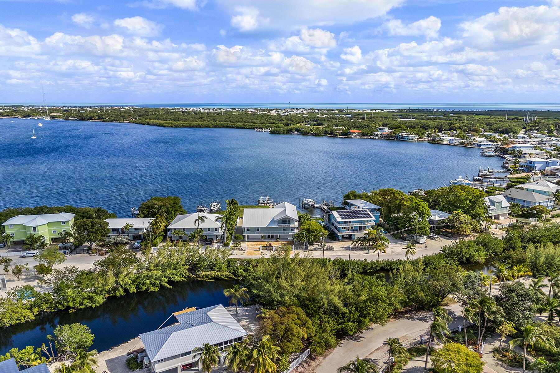 21 Mutiny Place Key Largo, FL 33037 - Photo 54 of 57 a view of a lake with houses in a back