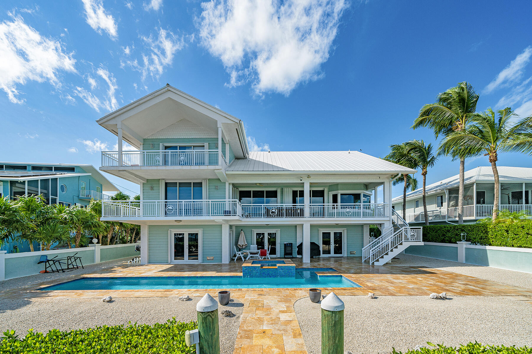 21 Mutiny Place Key Largo, FL 33037 - Photo 6 of 57 a front view of a house with a yard table and chairs