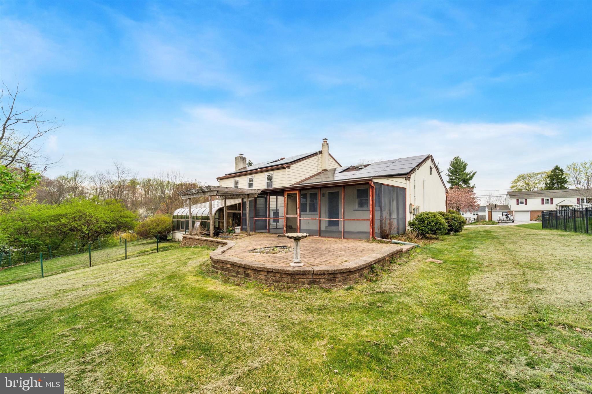 1220 Sylvan Road West Chester, PA 19382 - Photo 12 of 33 a white house with a big yard and large trees