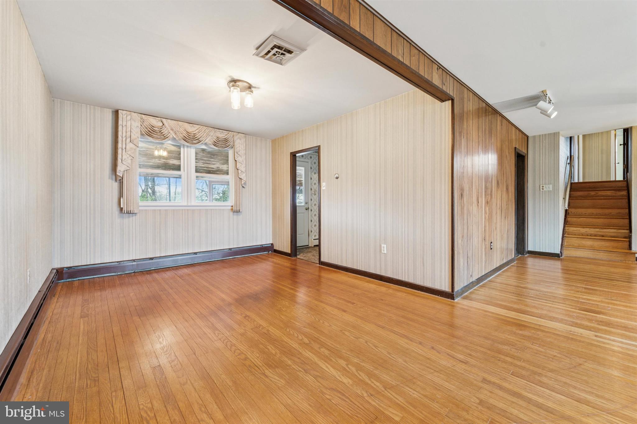 1220 Sylvan Road West Chester, PA 19382 - Photo 18 of 33 a view of an empty room with wooden floor and a window