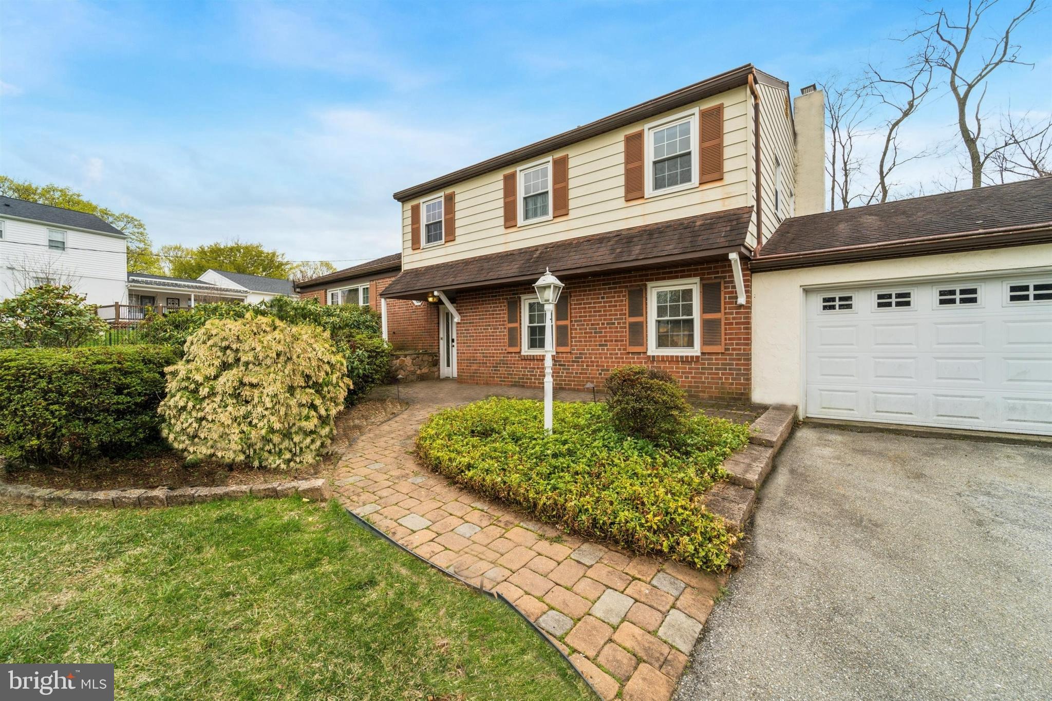 1220 Sylvan Road West Chester, PA 19382 - Photo 2 of 33 a front view of a house with garden
