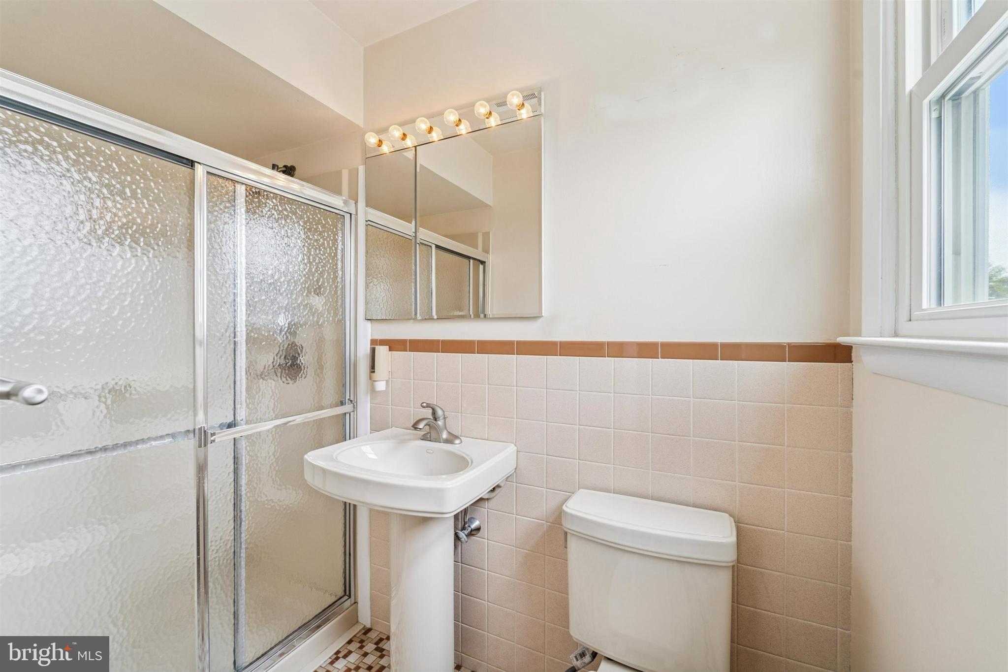 1220 Sylvan Road West Chester, PA 19382 - Photo 21 of 33 a bathroom with a sink a toilet and shower