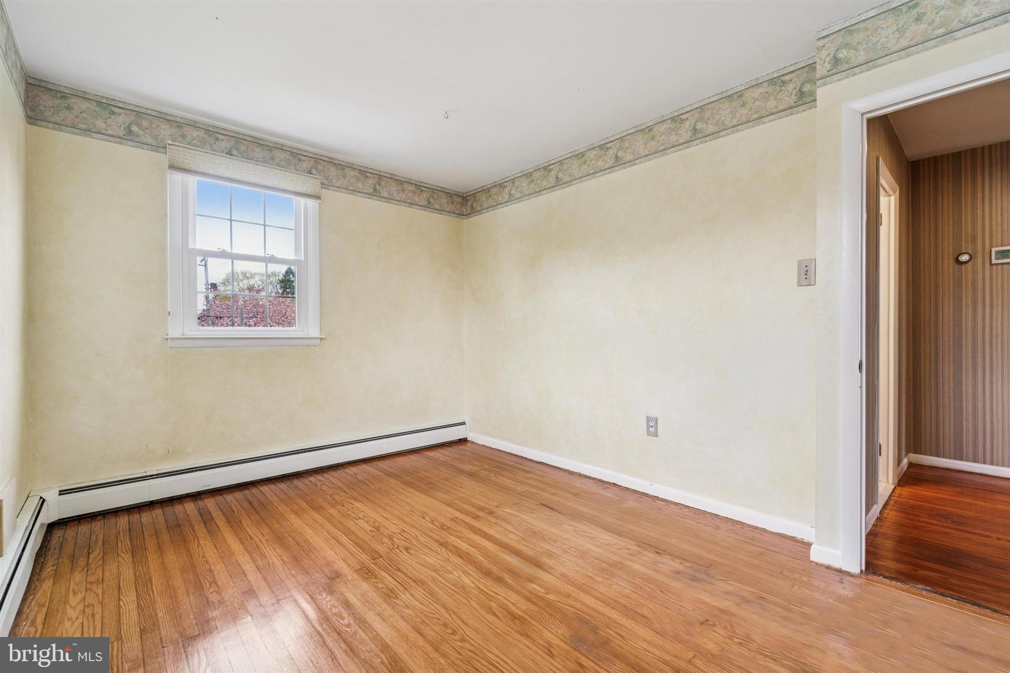 1220 Sylvan Road West Chester, PA 19382 - Photo 23 of 33 a view of empty room with wooden floor and fan