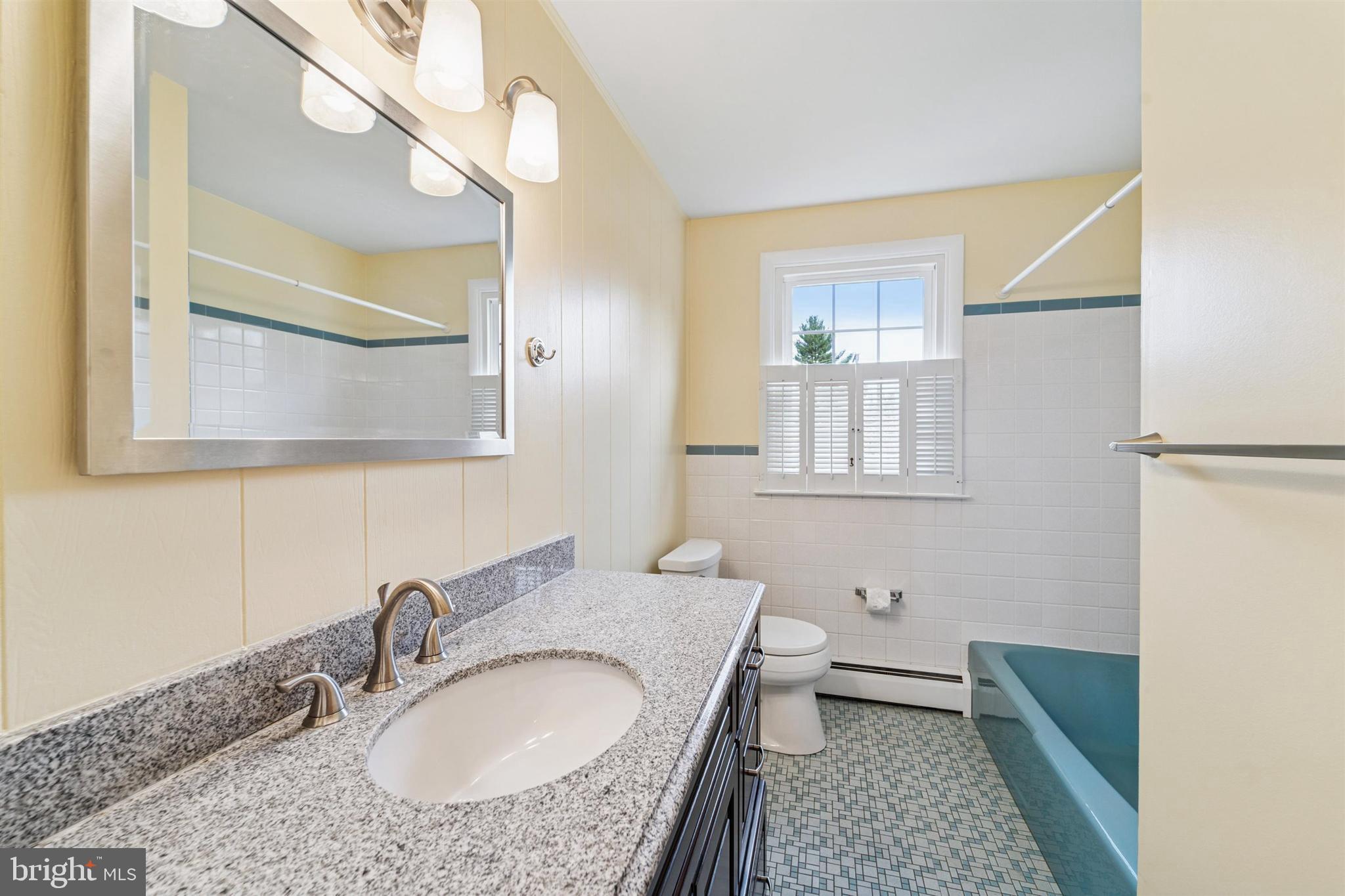 1220 Sylvan Road West Chester, PA 19382 - Photo 24 of 33 a bathroom with a sink a toilet and a mirror
