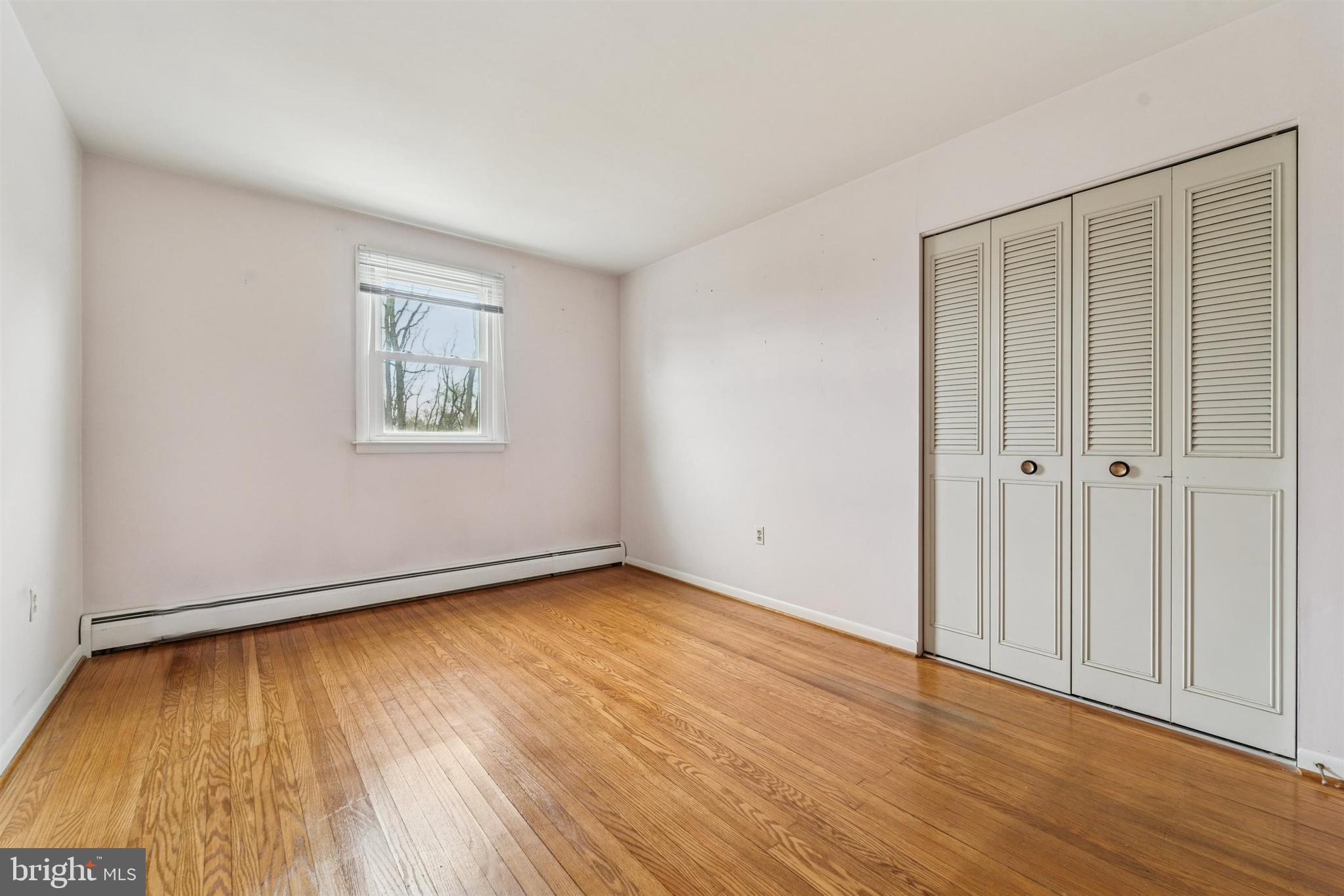 1220 Sylvan Road West Chester, PA 19382 - Photo 26 of 33 a view of an empty room with wooden floor and a window