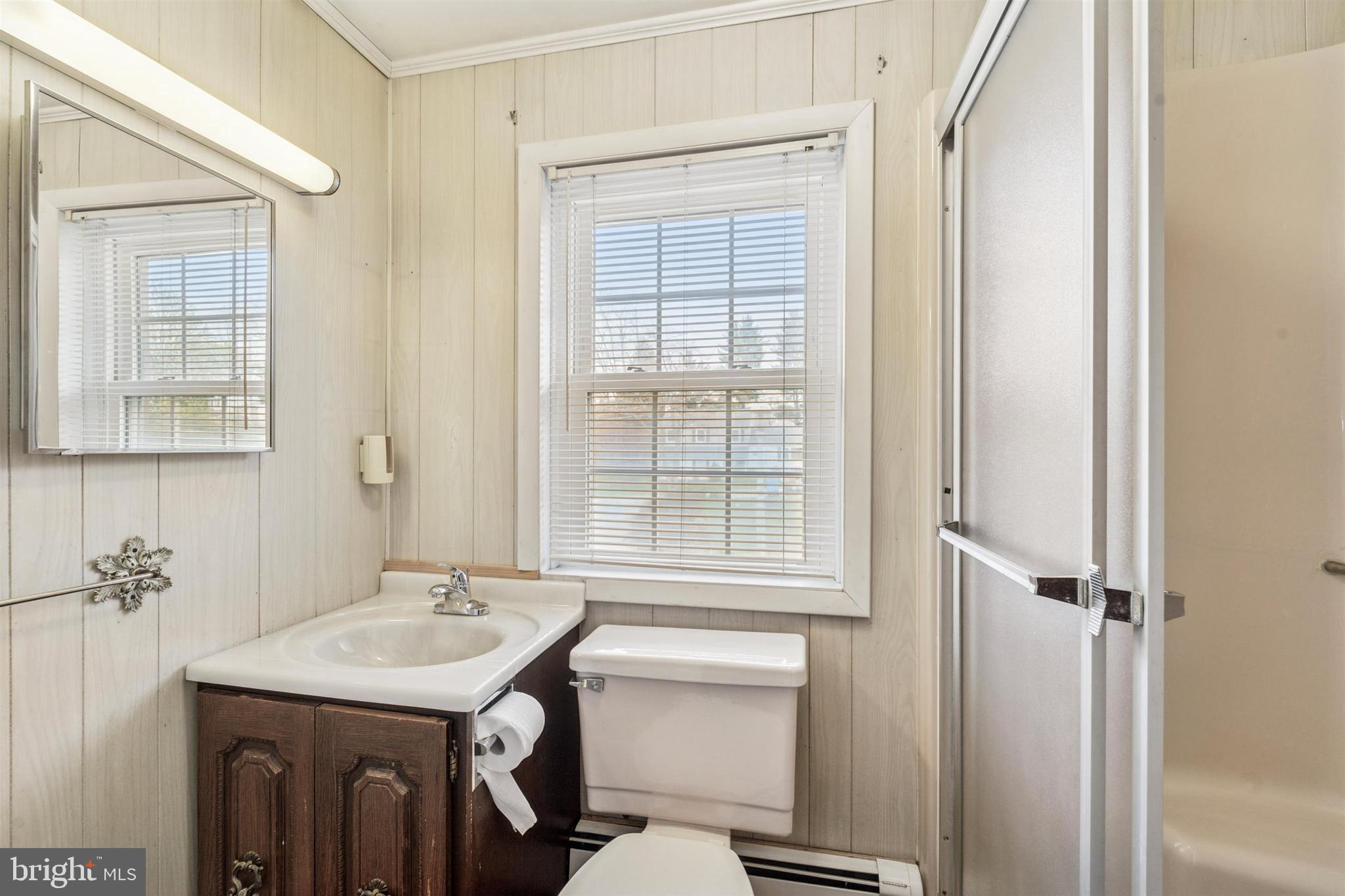 1220 Sylvan Road West Chester, PA 19382 - Photo 29 of 33 a bathroom with a sink a toilet and a mirror