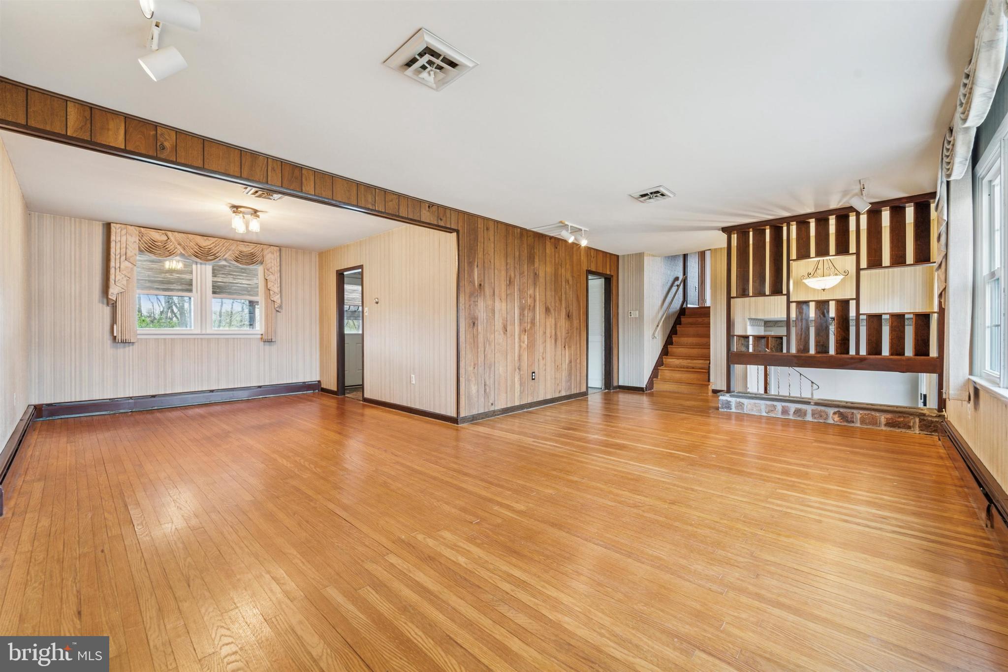 1220 Sylvan Road West Chester, PA 19382 - Photo 5 of 33 a view of an empty room with wooden floor and a window