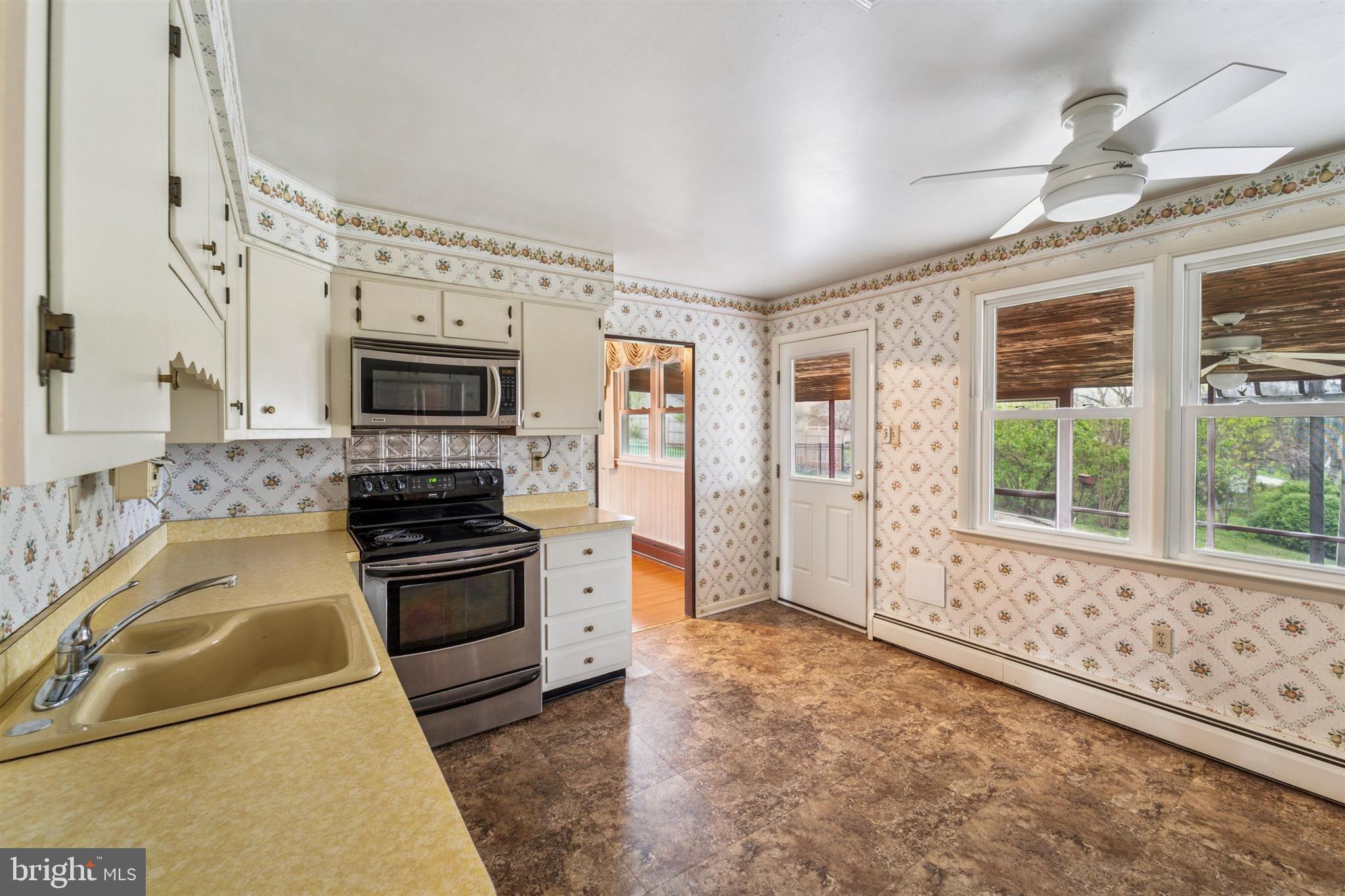 1220 Sylvan Road West Chester, PA 19382 - Photo 8 of 33 a kitchen with stainless steel appliances granite countertop a stove and a sink