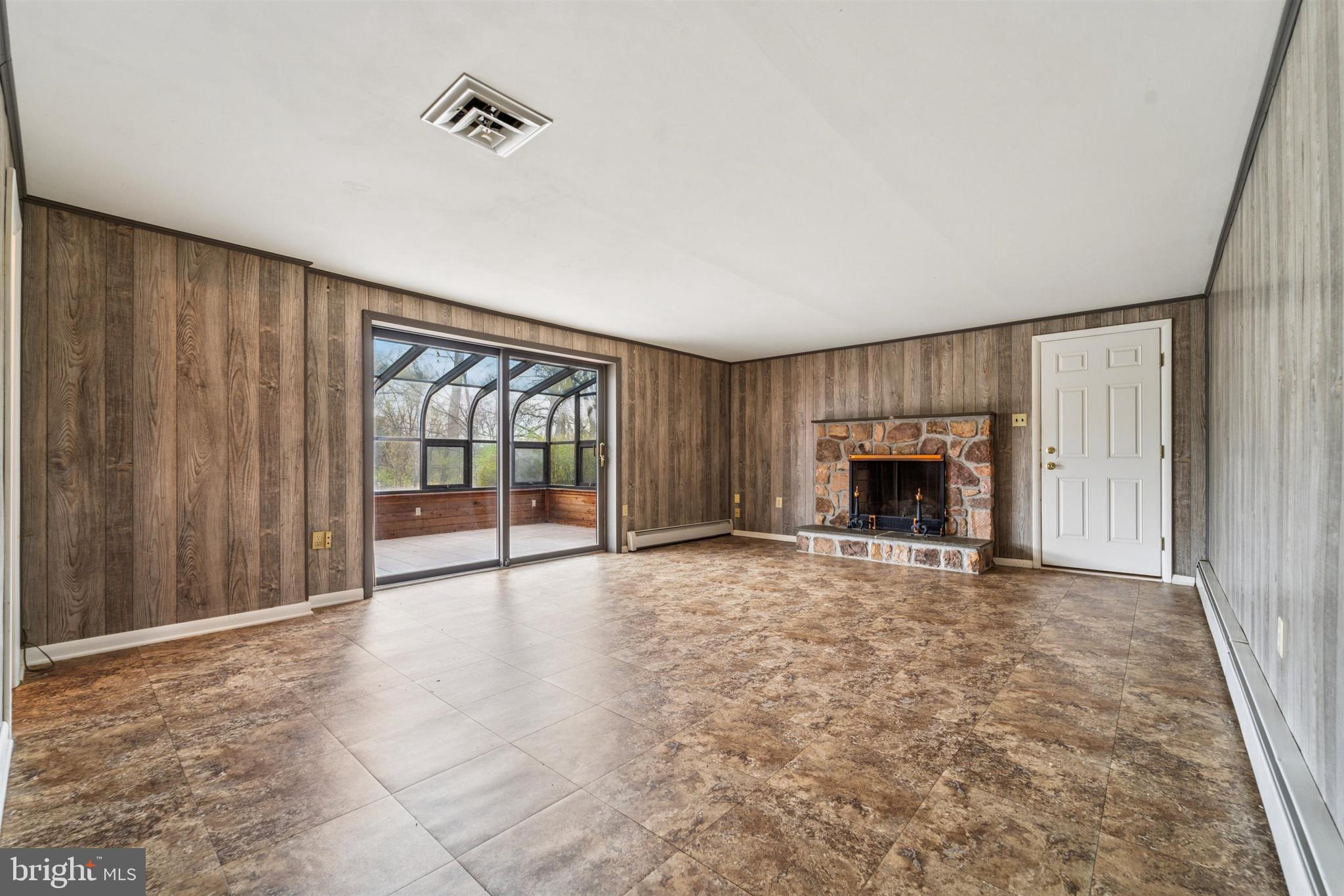 1220 Sylvan Road West Chester, PA 19382 - Photo 10 of 33 an empty room with fireplace and a window