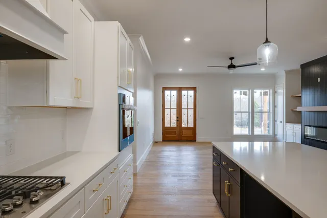 an empty room with windows and closet