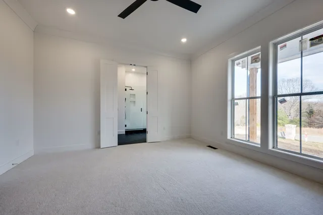 a bathroom with a glass shower door