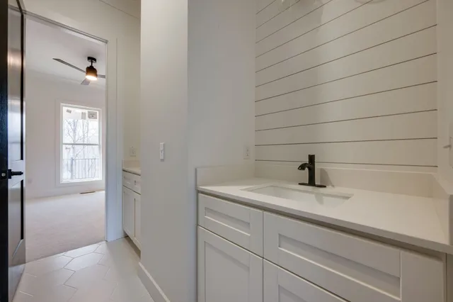 a bathroom with a sink and vanity