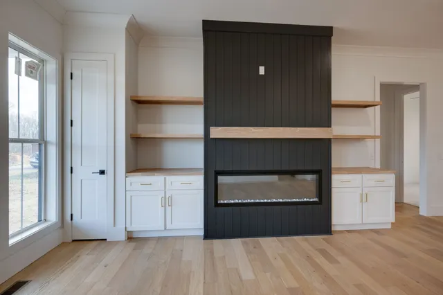 a view of a kitchen with a sink and a living room