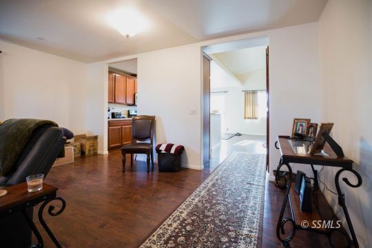 1609 South McCall Street Ridgecrest, CA 93555 - Photo 10 of 33 a living room with furniture gym equipment and a window