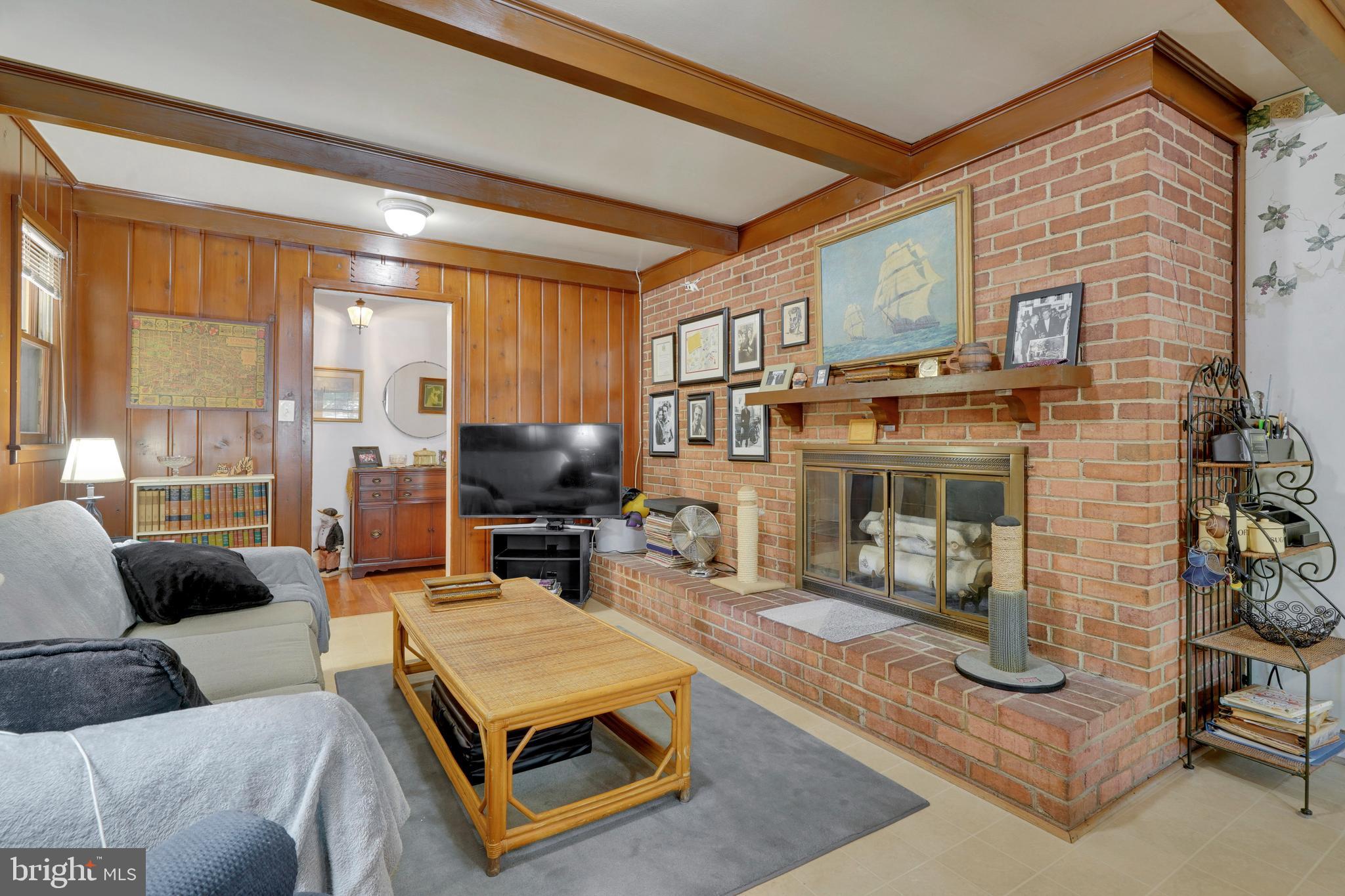 7614 Range Road Alexandria, VA 22306 - Photo 13 of 37 a living room with furniture and a fireplace