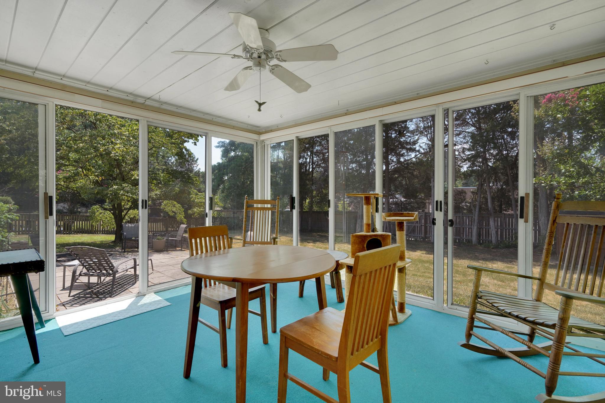 7614 Range Road Alexandria, VA 22306 - Photo 15 of 37 a dining room with furniture large windows and wooden floor