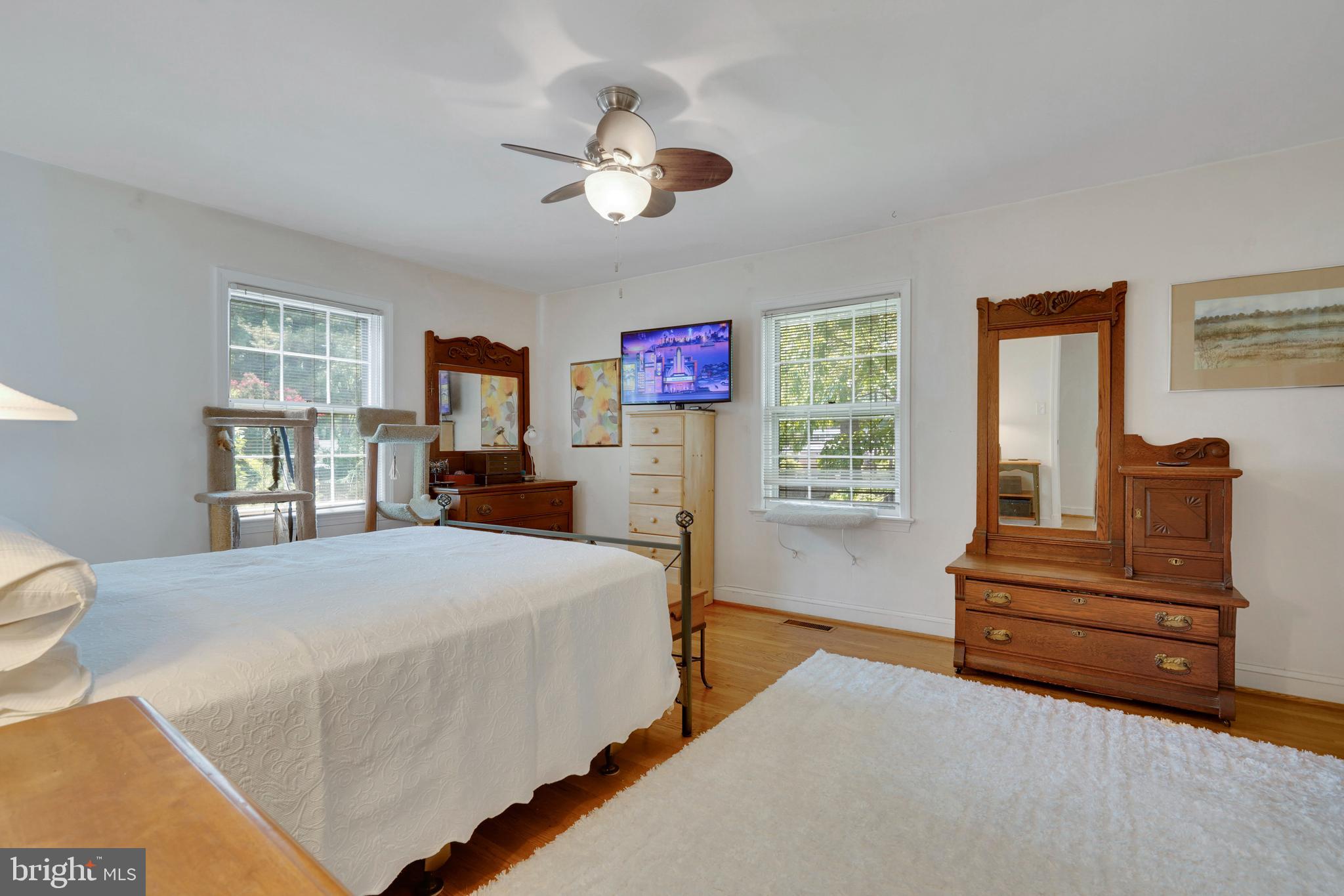 7614 Range Road Alexandria, VA 22306 - Photo 17 of 37 a spacious bedroom with a bed and dresser
