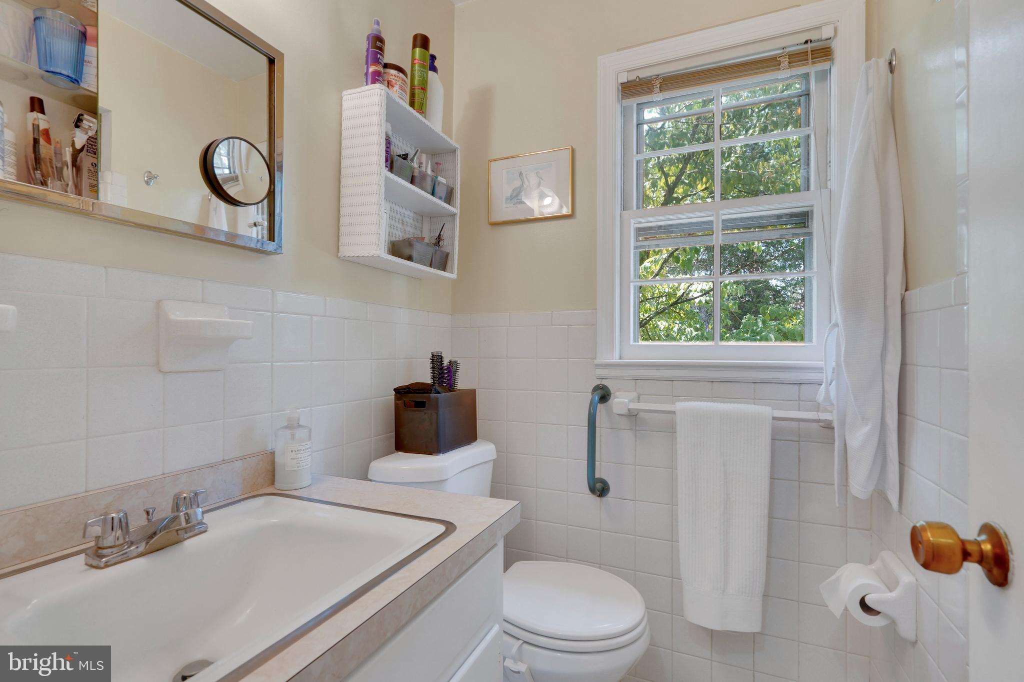 7614 Range Road Alexandria, VA 22306 - Photo 20 of 37 a bathroom with a sink a toilet and a shower