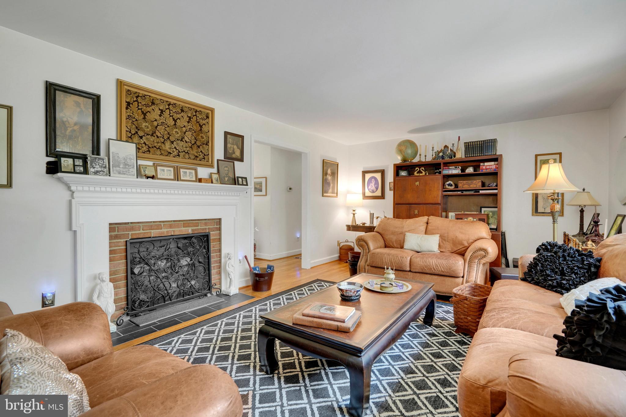 7614 Range Road Alexandria, VA 22306 - Photo 6 of 37 a living room with furniture and a fireplace