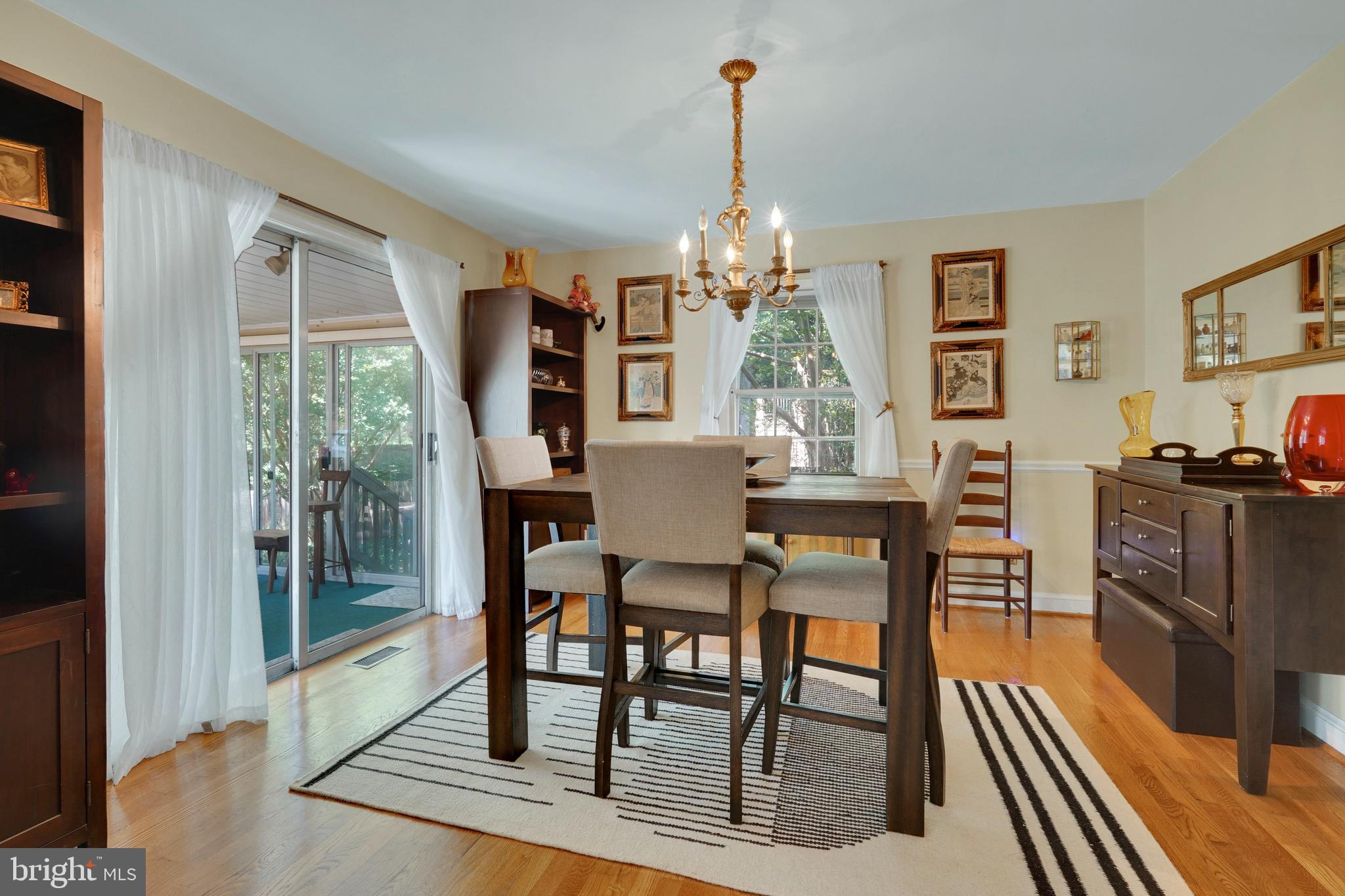 7614 Range Road Alexandria, VA 22306 - Photo 8 of 37 a view of a dining room with furniture window and wooden floor