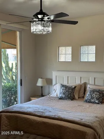 a bedroom with a bed and a window