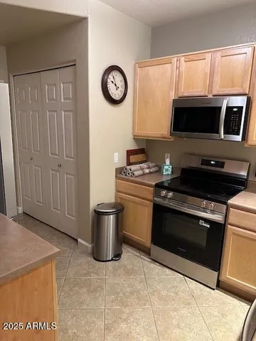 a kitchen with a stove and a microwave