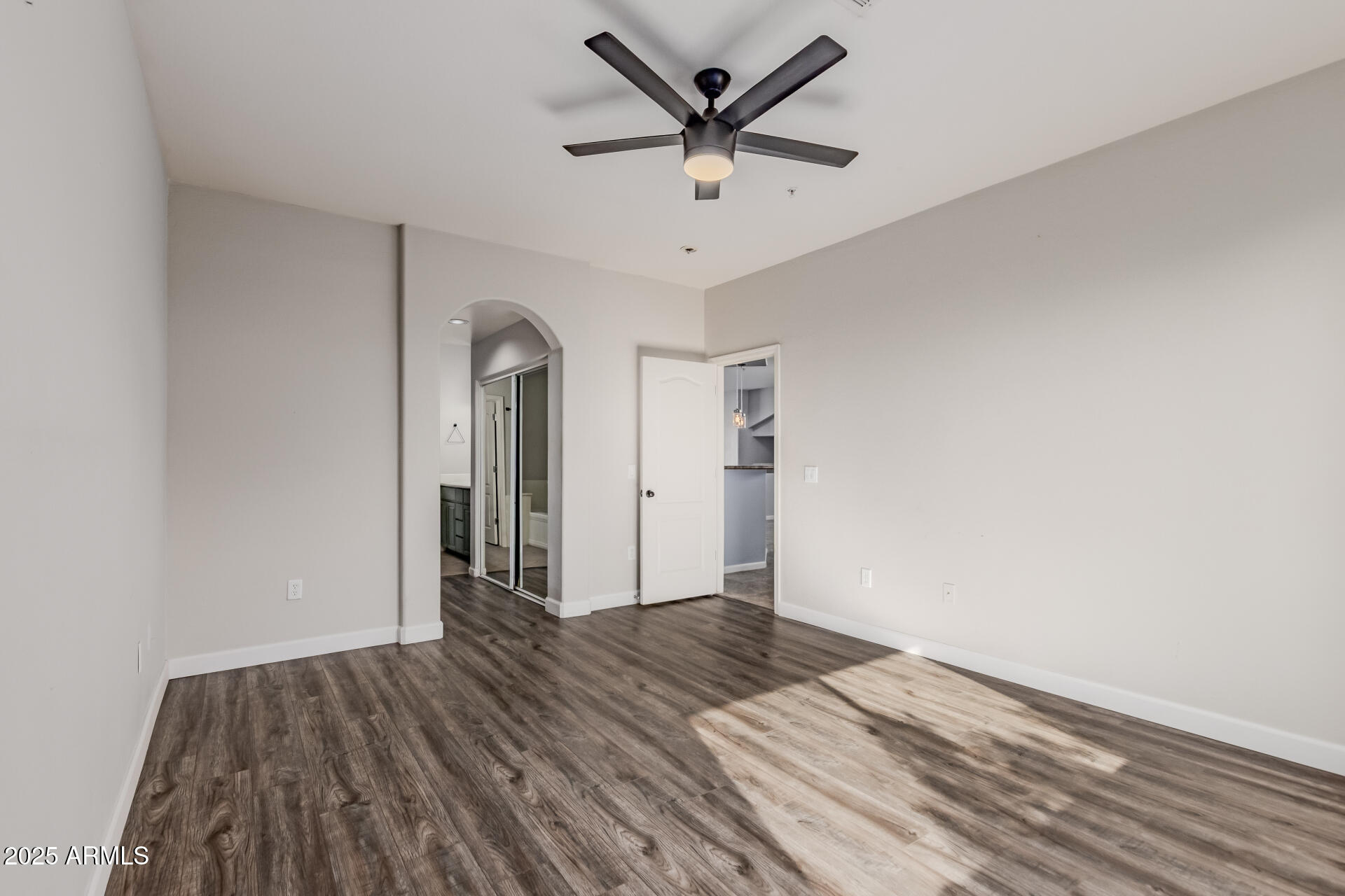 705 West Queen Creek Road, Unit 2146 Chandler, AZ 85248 - Photo 17 of 44 a view of a livingroom with wooden floor and a ceiling fan