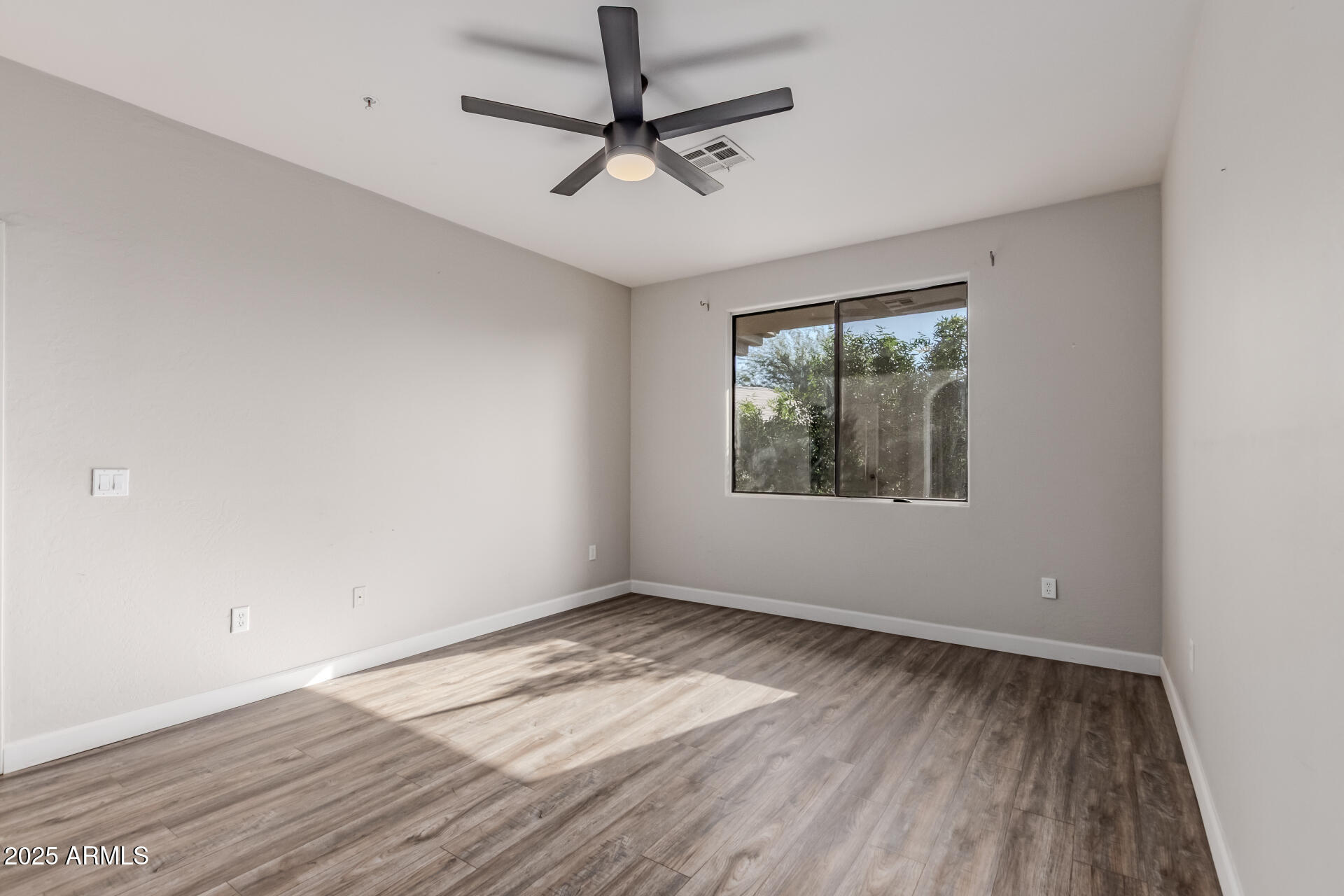 705 West Queen Creek Road, Unit 2146 Chandler, AZ 85248 - Photo 18 of 44 wooden floor in an empty room with a window
