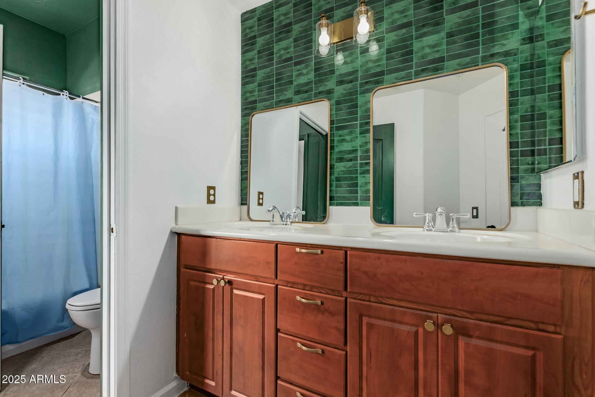 705 West Queen Creek Road, Unit 2146 Chandler, AZ 85248 - Photo 24 of 44 a bathroom with a sink and a mirror