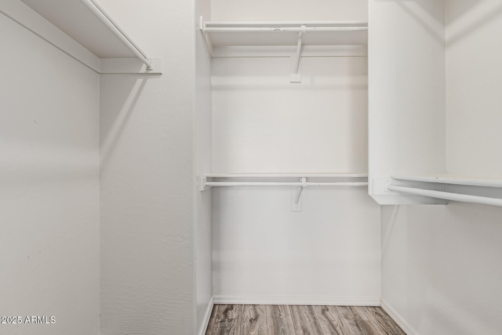 705 West Queen Creek Road, Unit 2146 Chandler, AZ 85248 - Photo 26 of 44 a view of walk in closet with empty racks