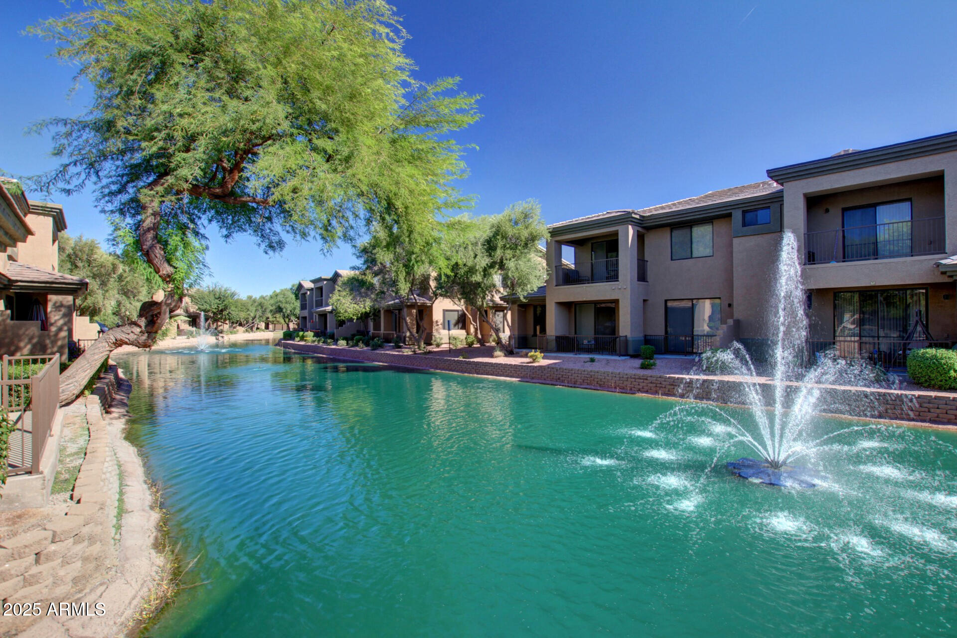 705 West Queen Creek Road, Unit 2146 Chandler, AZ 85248 - Photo 34 of 44 a house with swimming pool in front of it