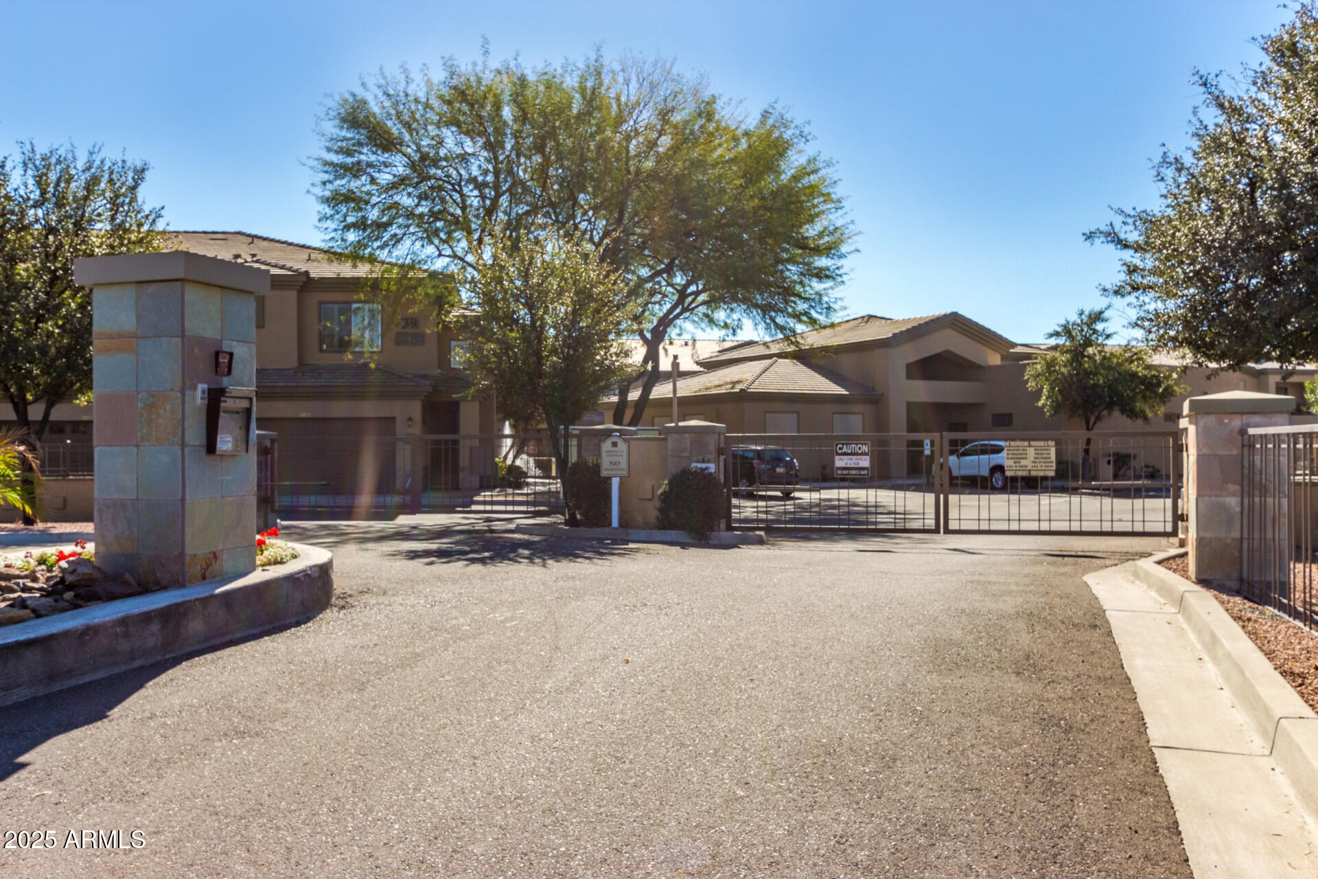 705 West Queen Creek Road, Unit 2146 Chandler, AZ 85248 - Photo 39 of 44 a view of a house with snow on the road