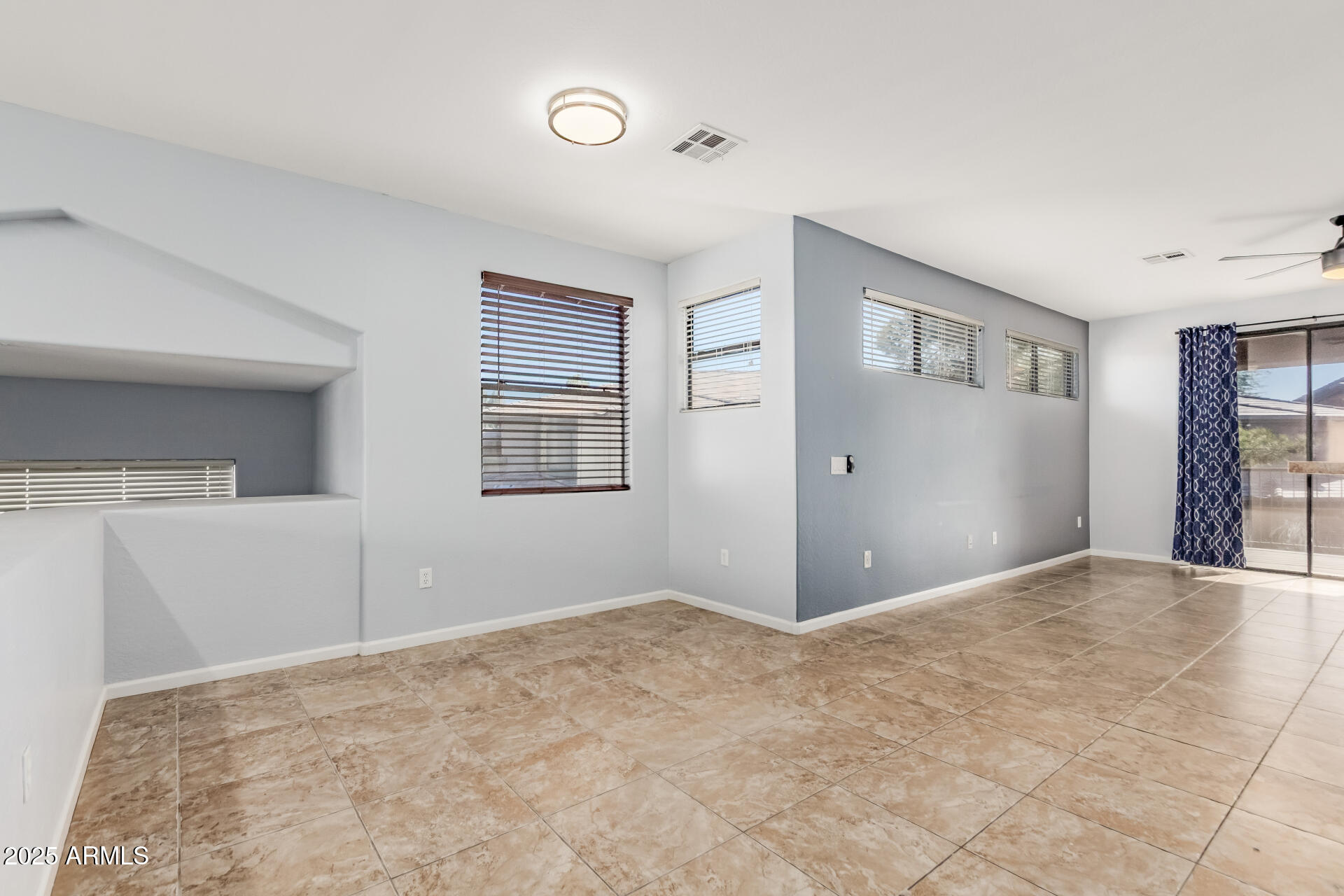 705 West Queen Creek Road, Unit 2146 Chandler, AZ 85248 - Photo 5 of 44 a view of an empty room with window and cabinet