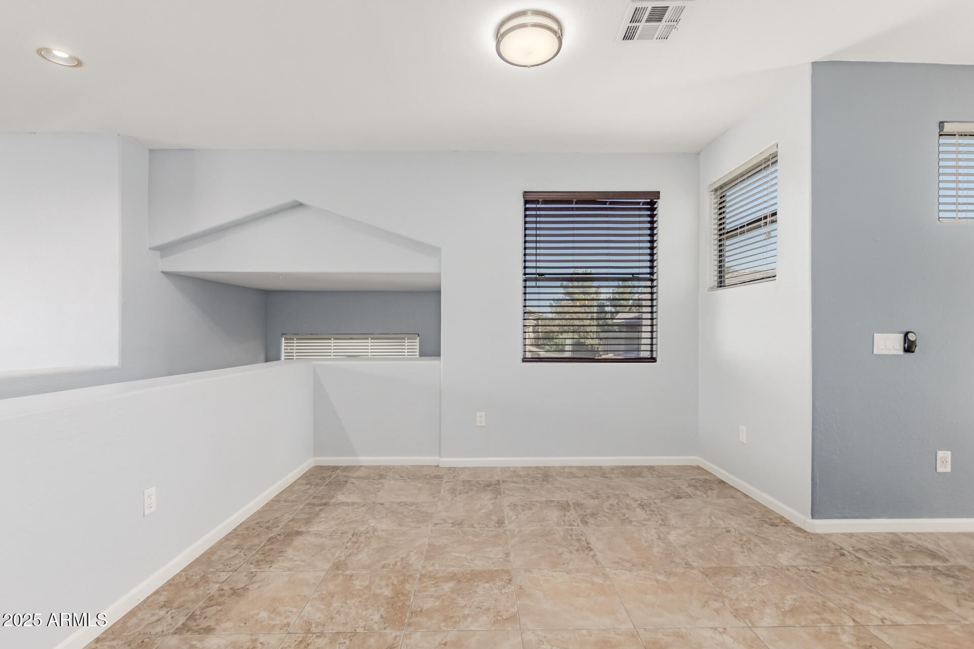 705 West Queen Creek Road, Unit 2146 Chandler, AZ 85248 - Photo 6 of 44 a view of an empty room with a window