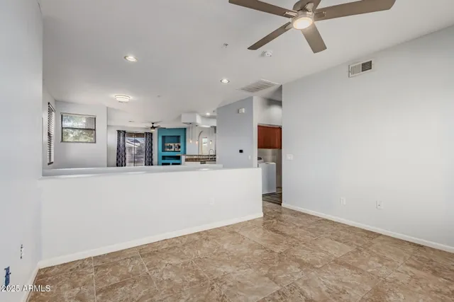 a view of a living room hardwood and a ceiling fan