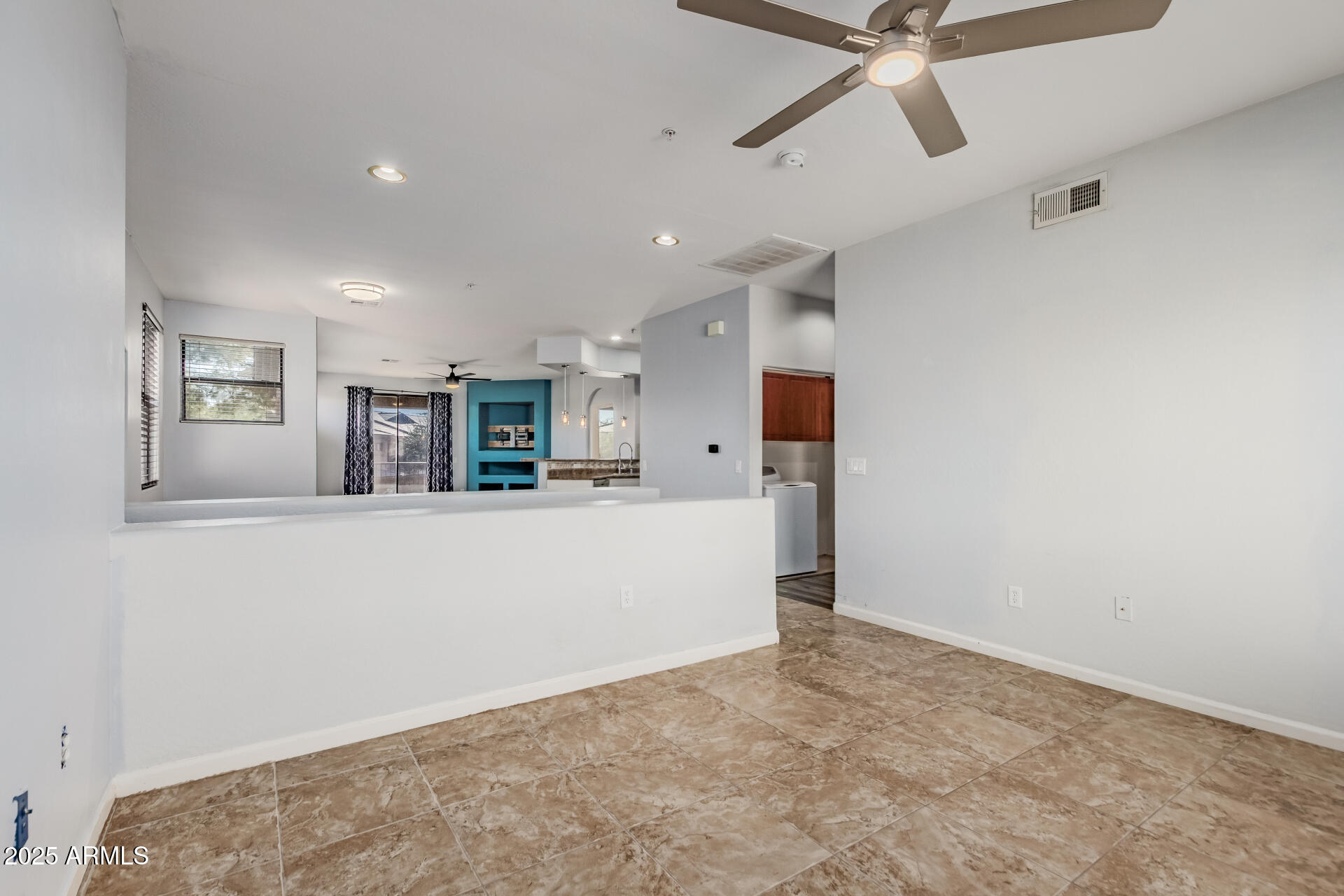 705 West Queen Creek Road, Unit 2146 Chandler, AZ 85248 - Photo 7 of 44 a view of a living room hardwood and a ceiling fan