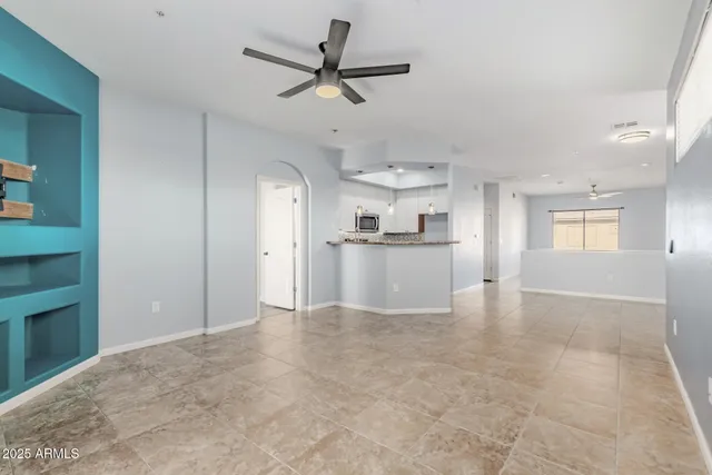 a view of a kitchen with a sink and a refrigerator