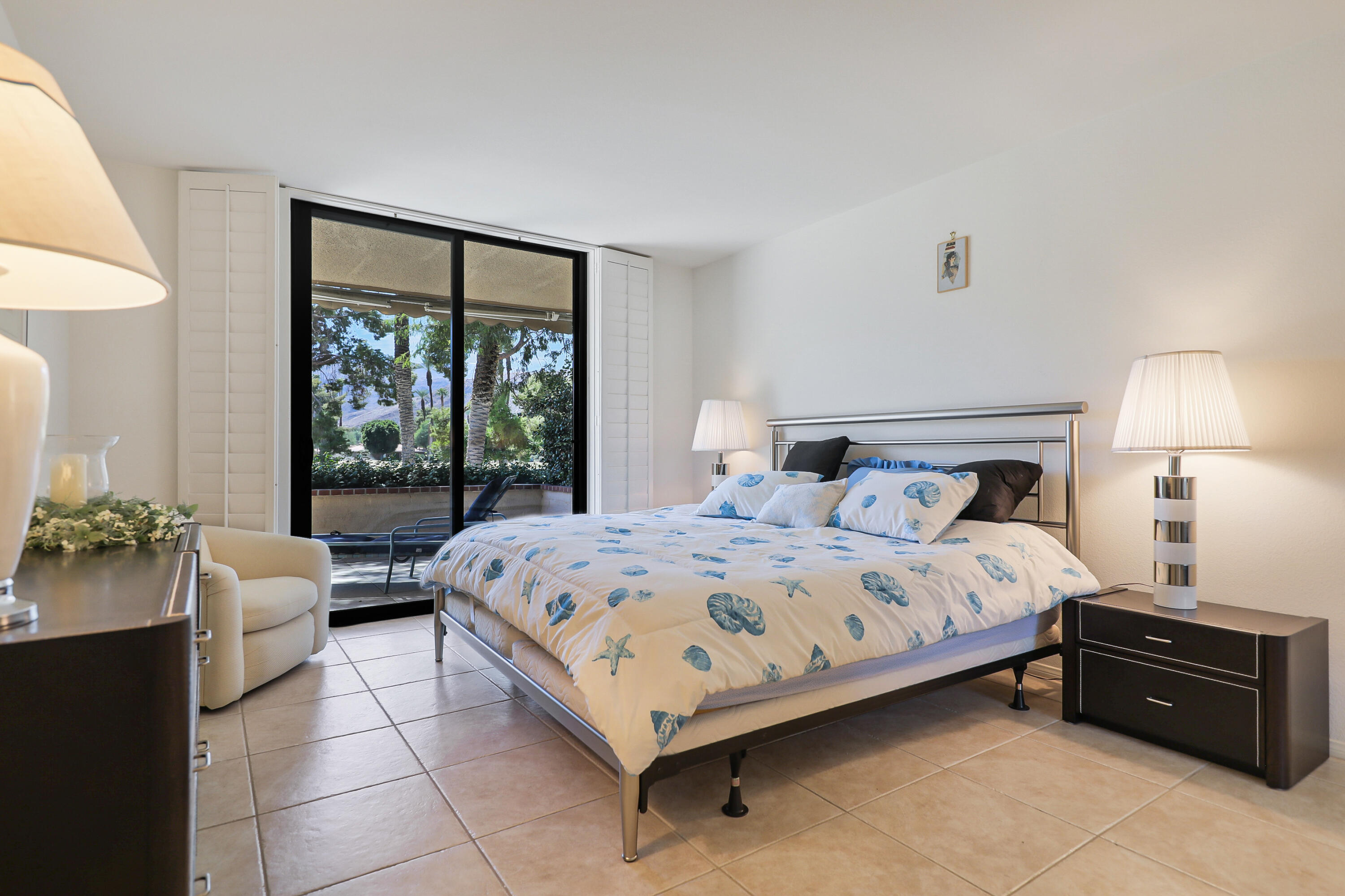 27 Seville Drive Rancho Mirage, CA 92270 - Photo 11 of 50 a bedroom with a bed and a couch