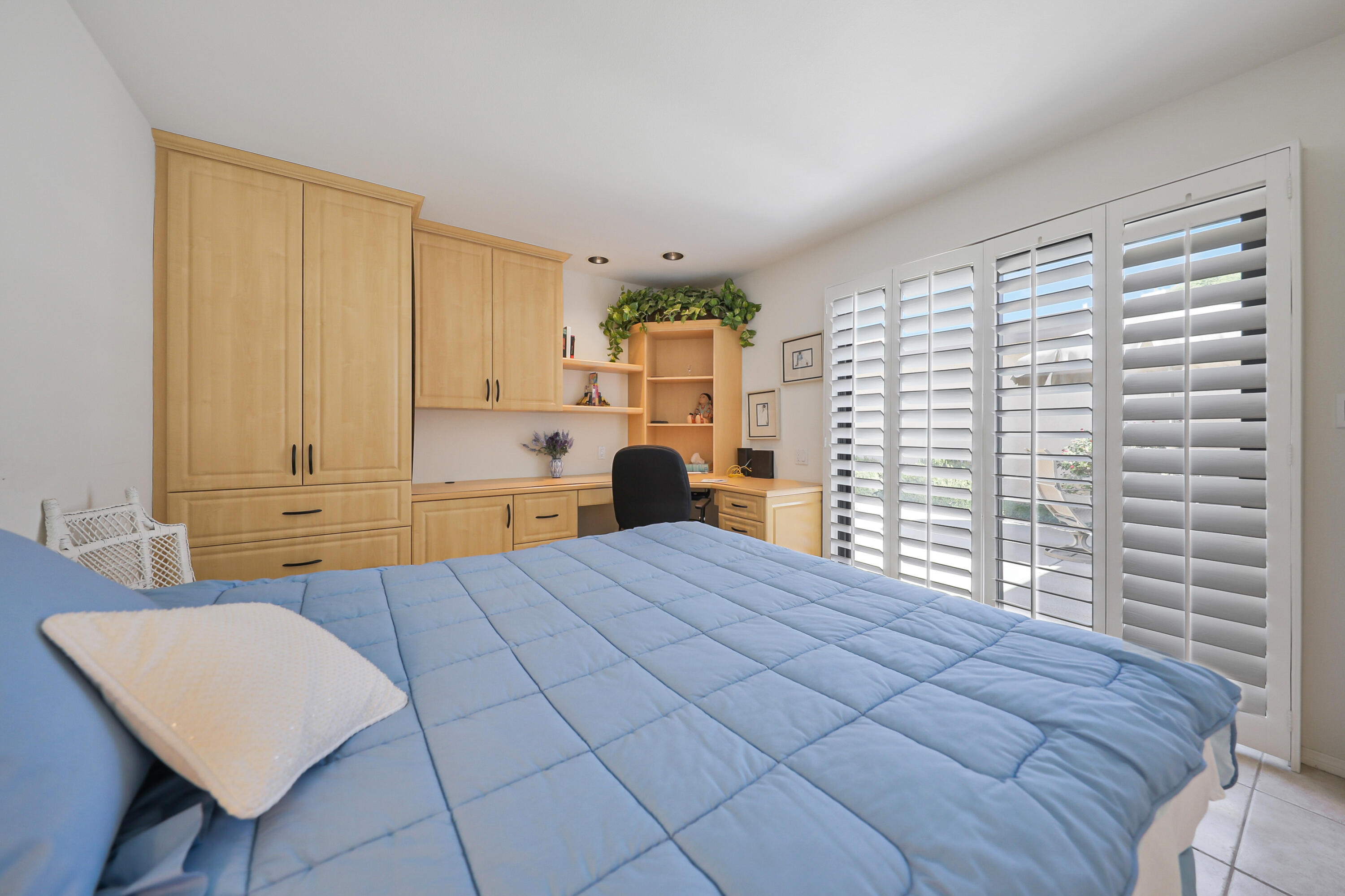 27 Seville Drive Rancho Mirage, CA 92270 - Photo 17 of 50 a bedroom with a bed dresser and a window