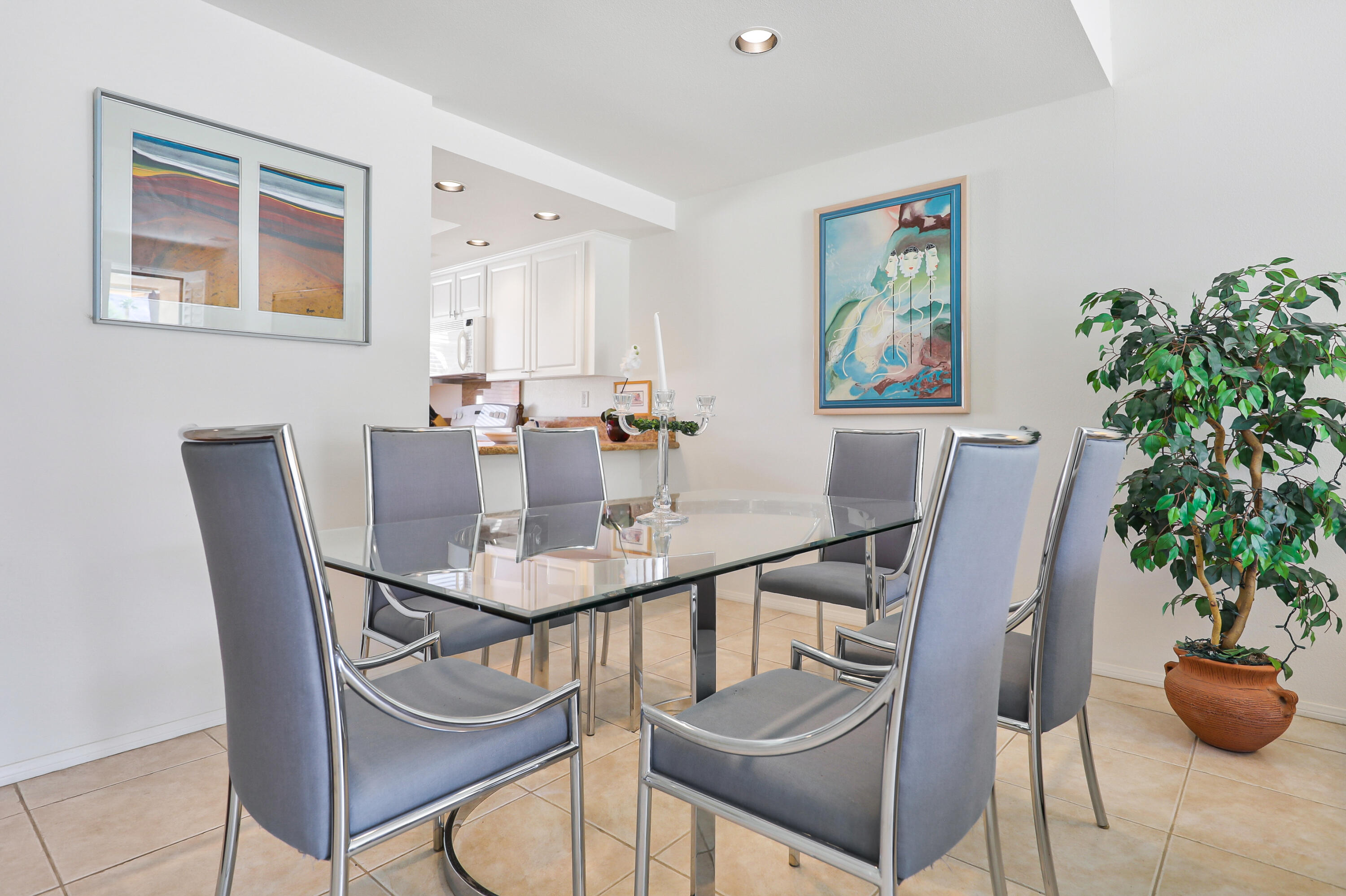 27 Seville Drive Rancho Mirage, CA 92270 - Photo 6 of 50 a view of a dining room with furniture and potted plant