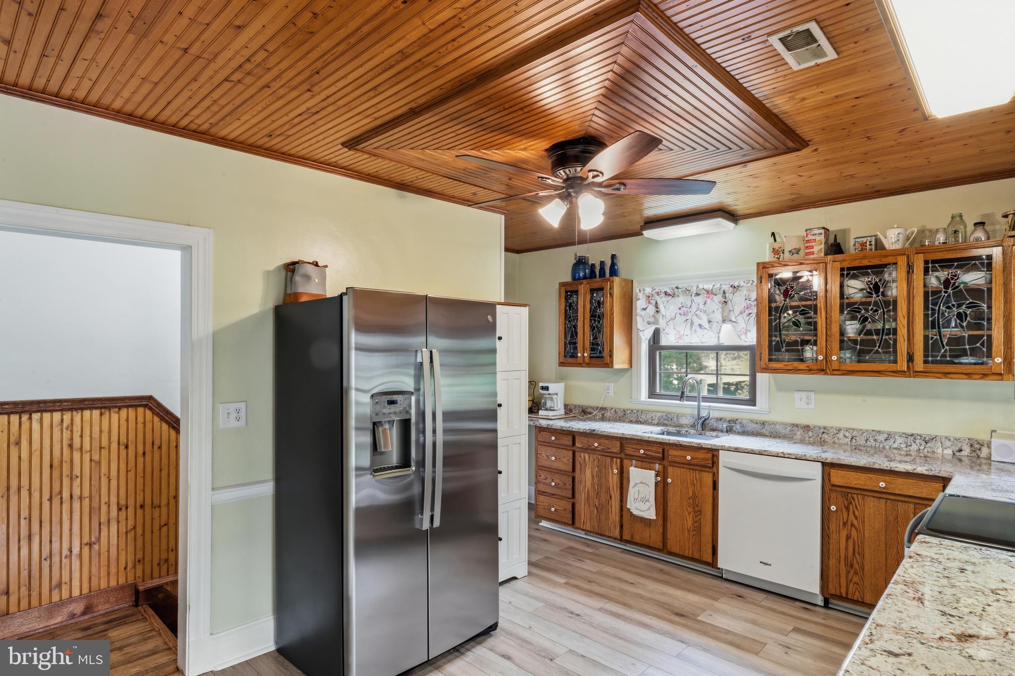 3593 Strasburg Road Strasburg, VA 22657 - Photo 19 of 113 a kitchen with stainless steel appliances granite countertop a refrigerator a sink and dishwasher