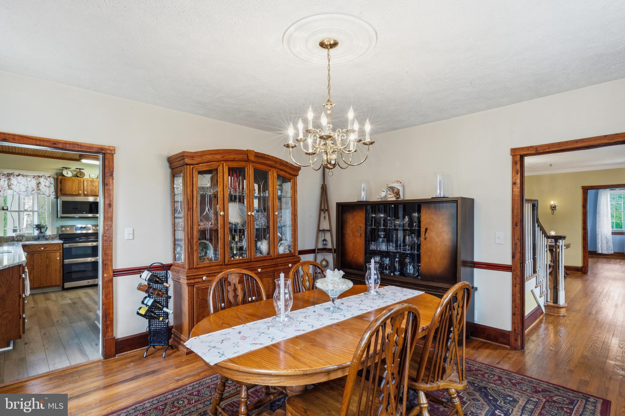 3593 Strasburg Road Strasburg, VA 22657 - Photo 22 of 113 a view of a dining room with furniture and wooden floor