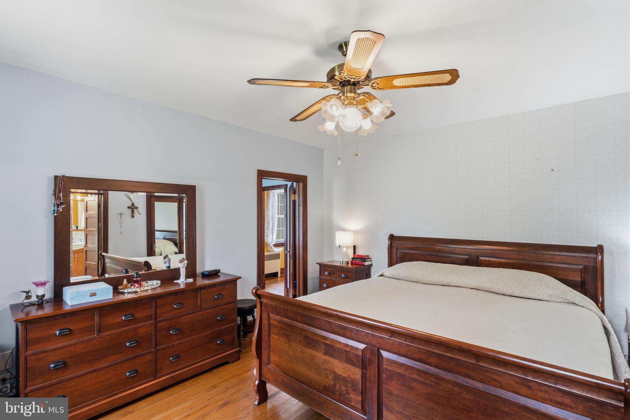 3593 Strasburg Road Strasburg, VA 22657 - Photo 29 of 113 a bedroom with a bed and wooden floor