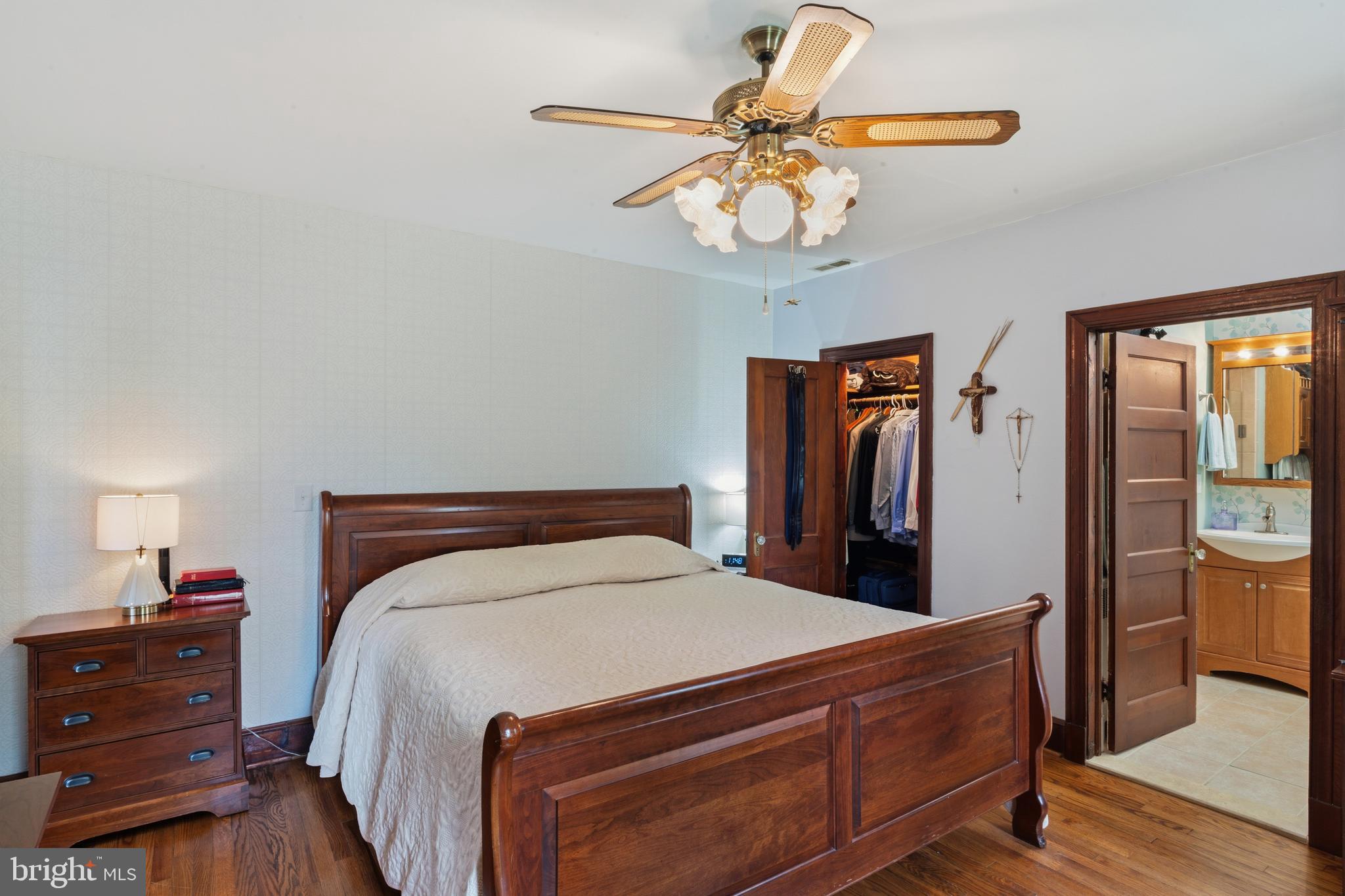 3593 Strasburg Road Strasburg, VA 22657 - Photo 30 of 113 a bedroom with a bed and a chandelier