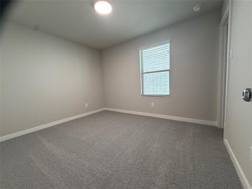 517 River Rdg Drive McKinney, TX 75071 - Photo 12 of 14 an empty room with a window