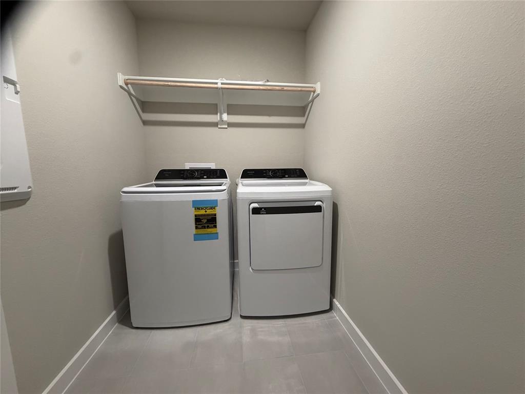 517 River Rdg Drive McKinney, TX 75071 - Photo 14 of 14 a utility room with dryer and washer